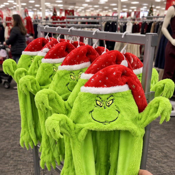 Grinchy hat close-up showing the plush face and Santa cap